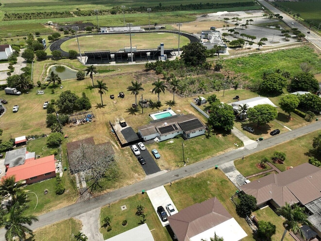 aerial view of property and surrounding area featuring rural landscape