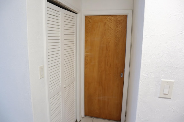 hall with a textured wall