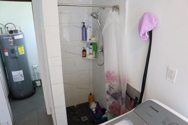 full bath with electric water heater, a shower stall, and tile patterned floors