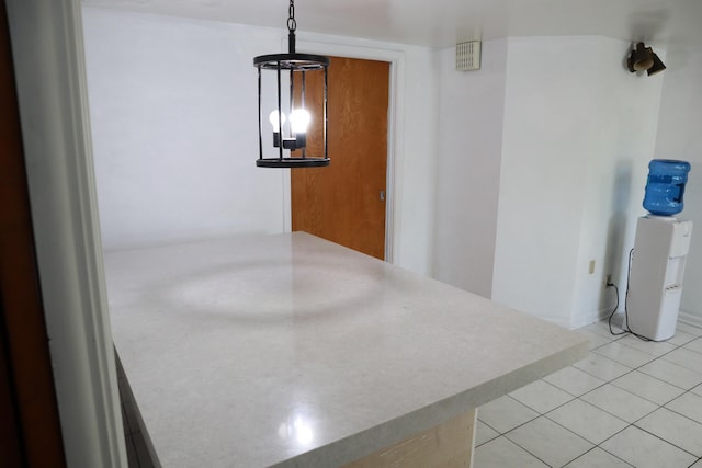 hall featuring light tile patterned floors
