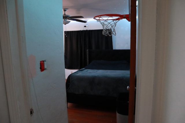 bedroom featuring wood finished floors and a ceiling fan