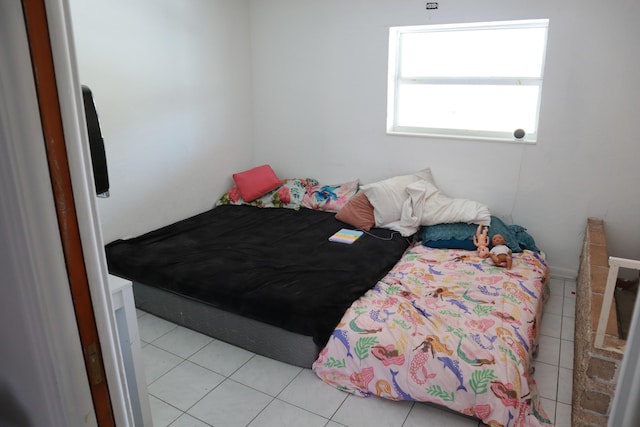 bedroom with light tile patterned flooring