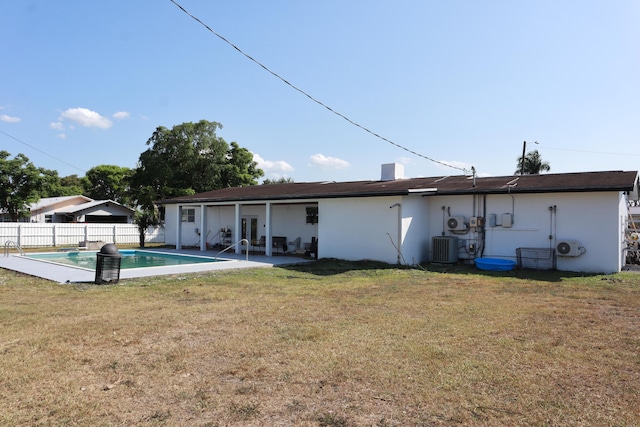 rear view of property featuring central AC, stucco siding, and a patio