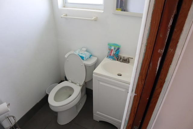 bathroom with tile patterned floors, toilet, and vanity
