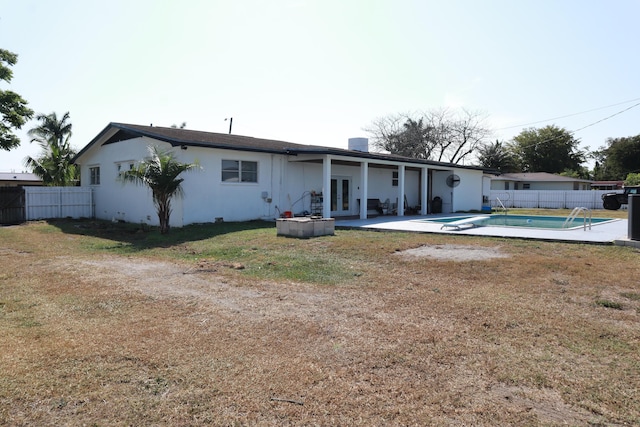 back of property featuring french doors and a patio area
