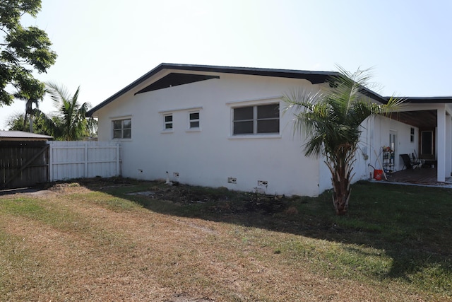 view of home's exterior featuring stucco siding and crawl space