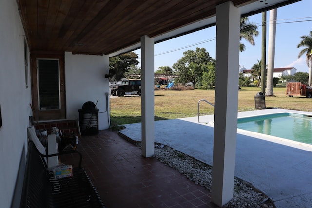360 Kismet Ave, Pahokee, FL 33476 - view of patio / terrace featuring an outdoor pool