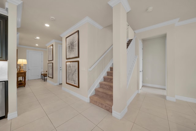 stairway with crown molding, tile patterned floors, recessed lighting, and baseboards