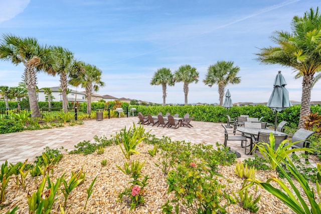 view of yard with outdoor dining space and a patio