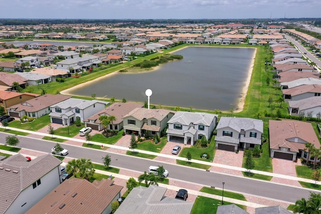 aerial perspective of suburban area with a large body of water
