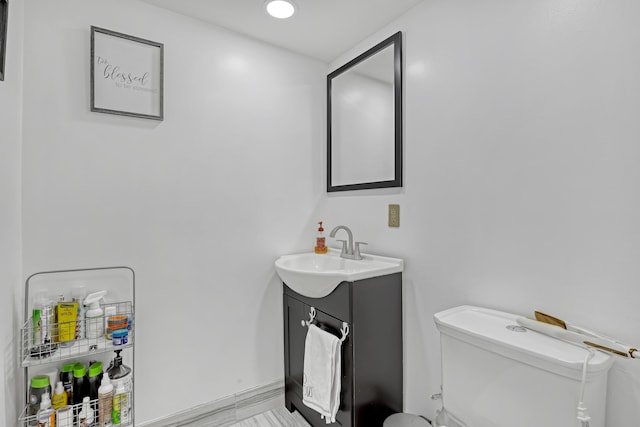 half bath with toilet and vanity