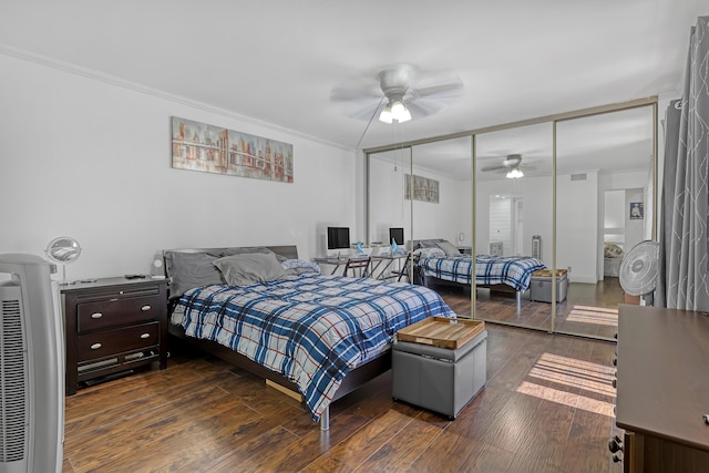 bedroom featuring wood finished floors, a closet, and ceiling fan