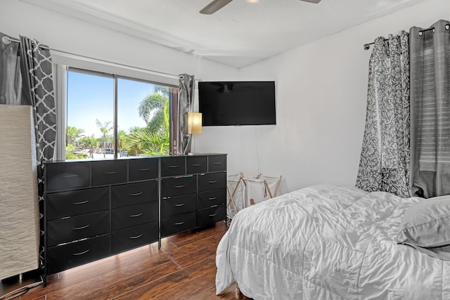 bedroom featuring dark wood-style floors and a ceiling fan