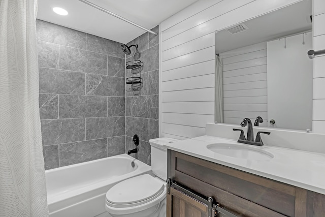 bathroom with shower / bath combo with shower curtain, toilet, vanity, and recessed lighting