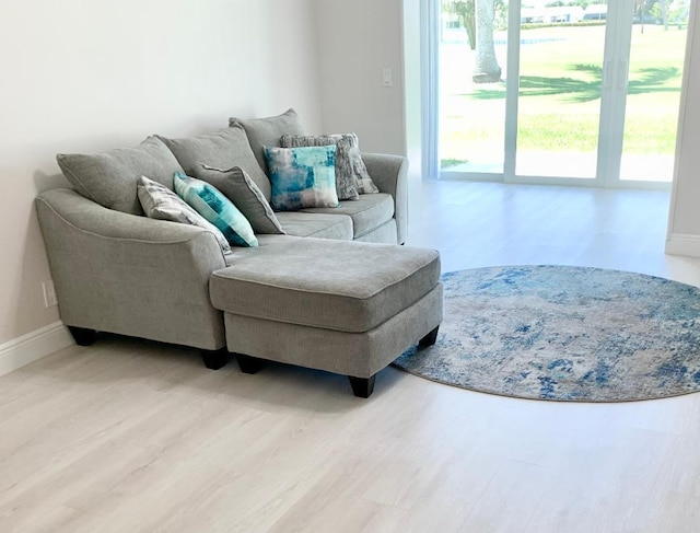 1802 Ocean Dr Unit 112, Boynton Beach, FL 33426 - living room with light wood finished floors and baseboards