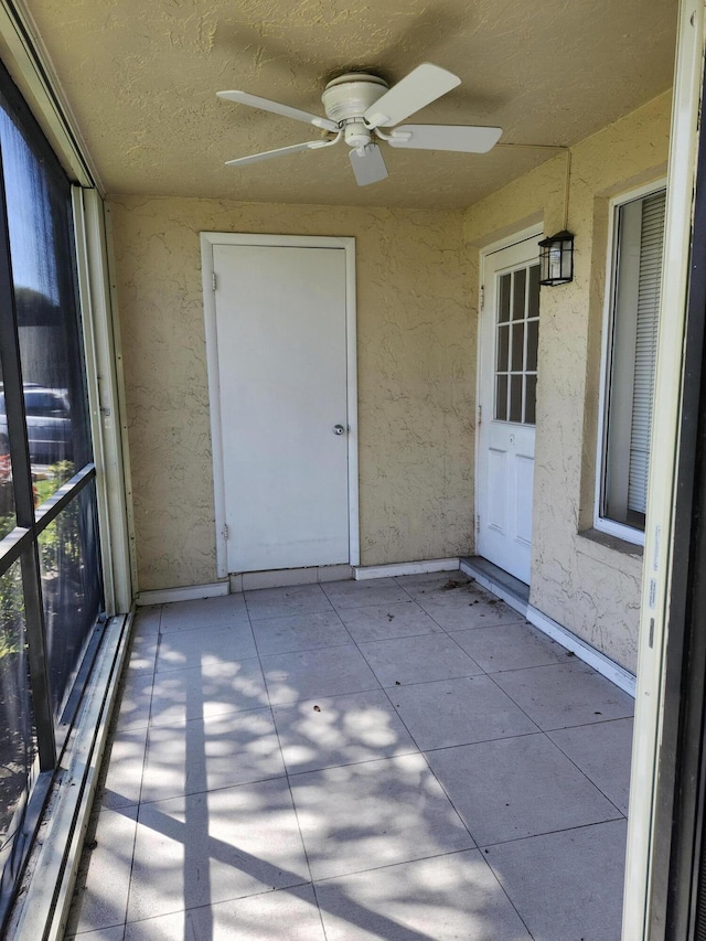 3587 La Playas Ct Unit A-1, Greenacres, FL 33463 - unfurnished sunroom featuring a ceiling fan