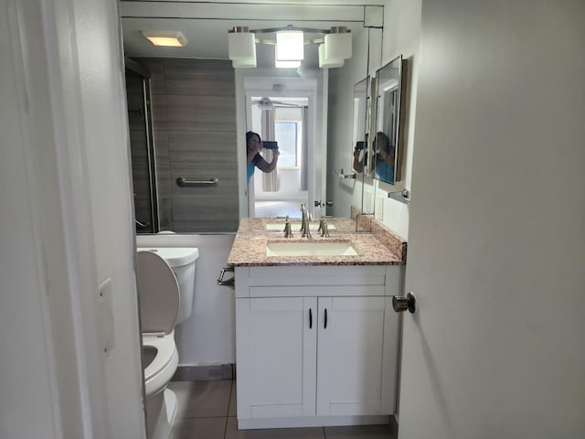 3587 La Playas Ct Unit A-1, Greenacres, FL 33463 - bathroom with toilet, tile patterned flooring, and vanity