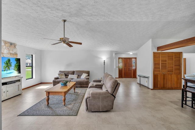 1290 SE Mcfarlane Ave, Port Saint Lucie, FL 34952 - living room with ceiling fan, light tile patterned floors, a textured ceiling, and baseboards