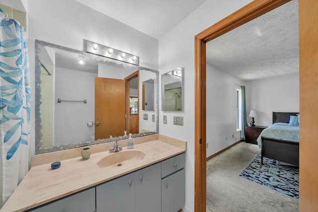 1290 SE Mcfarlane Ave, Port Saint Lucie, FL 34952 - ensuite bathroom with concrete floors, baseboards, vanity, a textured ceiling, and curtained shower