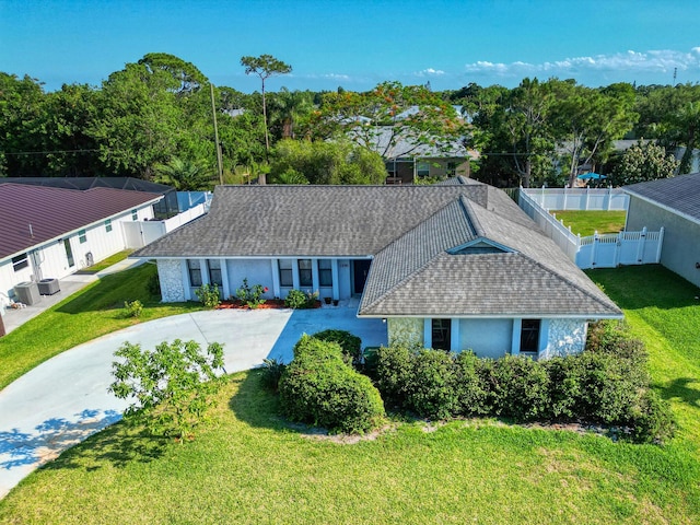 1290 SE Mcfarlane Ave, Port Saint Lucie, FL 34952 - single story home with roof with shingles and central AC