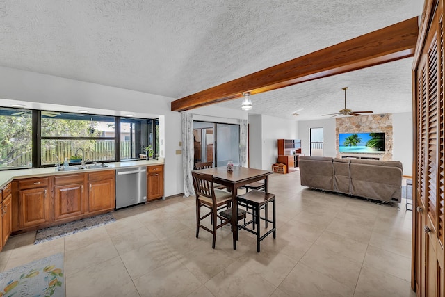 1290 SE Mcfarlane Ave, Port Saint Lucie, FL 34952 - dining area featuring a textured ceiling, beamed ceiling, light tile patterned flooring, and a ceiling fan