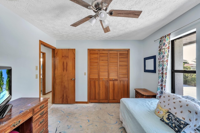 1290 SE Mcfarlane Ave, Port Saint Lucie, FL 34952 - bedroom with a closet, a textured ceiling, and a ceiling fan