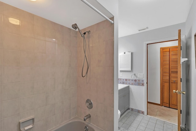 1290 SE Mcfarlane Ave, Port Saint Lucie, FL 34952 - full bath with tile patterned flooring, shower / washtub combination, and vanity