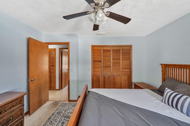 1290 SE Mcfarlane Ave, Port Saint Lucie, FL 34952 - bedroom with a closet, a textured ceiling, and ceiling fan