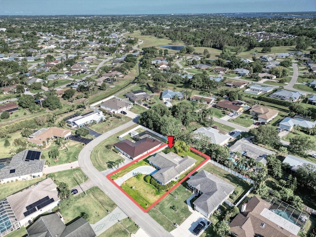 1290 SE Mcfarlane Ave, Port Saint Lucie, FL 34952 - aerial view of residential area with property boundaries highlighted and a large body of water
