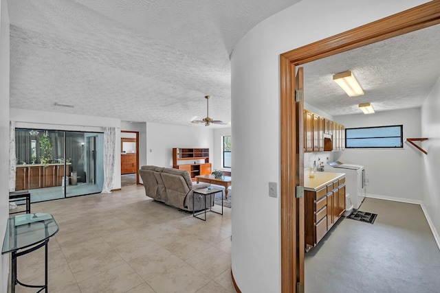 1290 SE Mcfarlane Ave, Port Saint Lucie, FL 34952 - corridor with a textured ceiling and baseboards