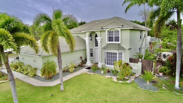 15511 63rd Pl N, Loxahatchee, FL 33470 - back of house featuring a lawn, stucco siding, and a tiled roof