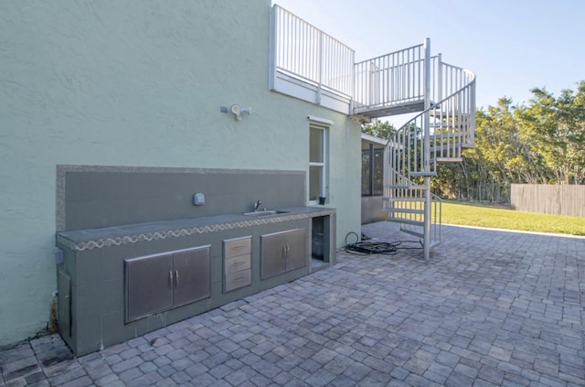15511 63rd Pl N, Loxahatchee, FL 33470 - view of patio with stairs, a sink, area for grilling, and fence