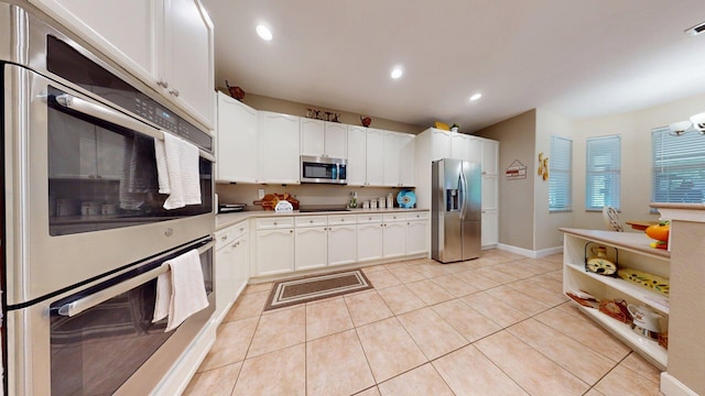 15511 63rd Pl N, Loxahatchee, FL 33470 - kitchen featuring appliances with stainless steel finishes, white cabinets, recessed lighting, light tile patterned floors, and baseboards