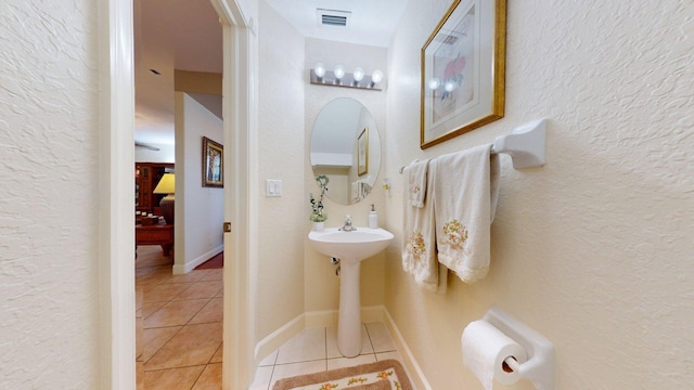 15511 63rd Pl N, Loxahatchee, FL 33470 - ensuite bathroom with tile patterned flooring and a textured wall