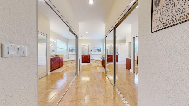15511 63rd Pl N, Loxahatchee, FL 33470 - hall with a textured wall and light tile patterned floors