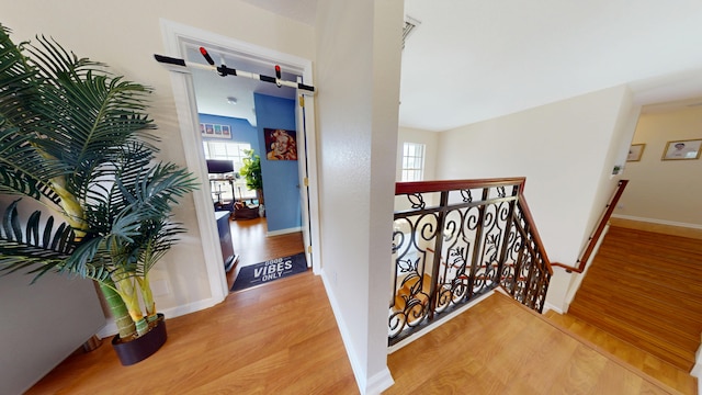 15511 63rd Pl N, Loxahatchee, FL 33470 - hall featuring an upstairs landing, wood finished floors, and healthy amount of natural light