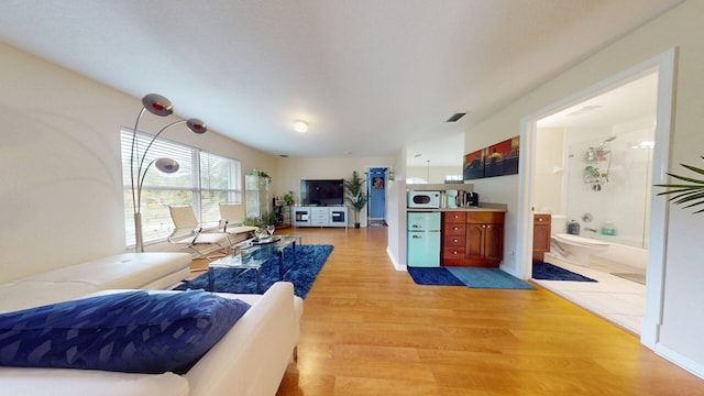 15511 63rd Pl N, Loxahatchee, FL 33470 - living room with light wood-style flooring