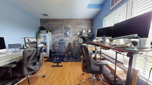 15511 63rd Pl N, Loxahatchee, FL 33470 - home office featuring an accent wall, wooden walls, and wood finished floors