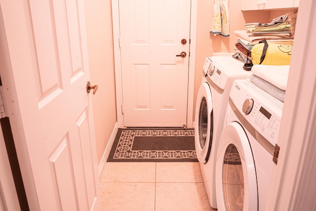 1366 Crossbill Ct, Weston, FL 33327 - laundry area featuring washing machine and dryer, tile patterned floors, and baseboards