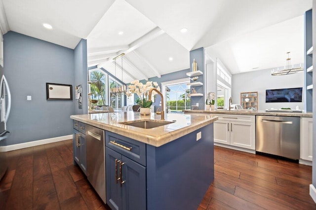 5211 SW Bimini Cir N, Palm City, FL 34990 - kitchen featuring stainless steel appliances, a sink, blue cabinetry, light countertops, and dark wood finished floors