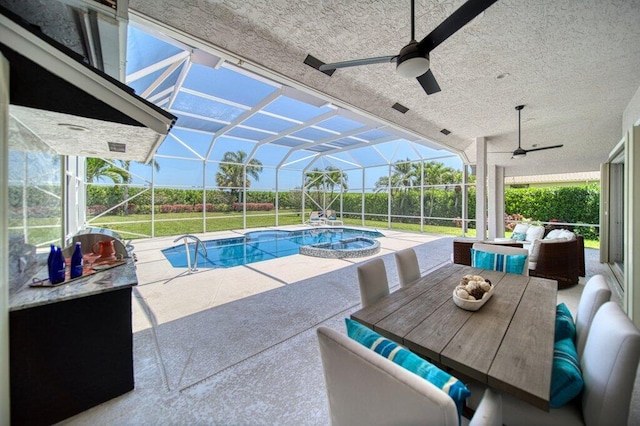 5211 SW Bimini Cir N, Palm City, FL 34990 - view of swimming pool with a ceiling fan, a patio area, a lanai, a pool with connected hot tub, and outdoor dining area