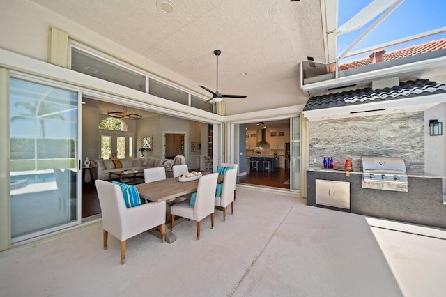 5211 SW Bimini Cir N, Palm City, FL 34990 - view of patio / terrace with an outdoor kitchen, a ceiling fan, grilling area, and outdoor dining area