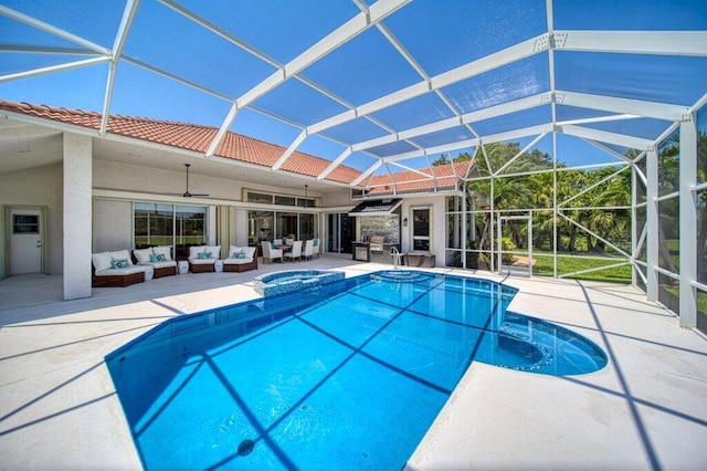5211 SW Bimini Cir N, Palm City, FL 34990 - view of pool with an outdoor living space, a patio area, ceiling fan, a pool with connected hot tub, and a lanai