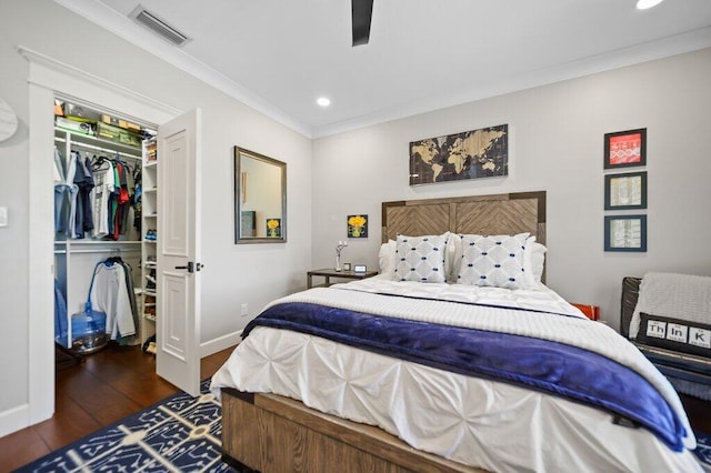 5211 SW Bimini Cir N, Palm City, FL 34990 - bedroom with a spacious closet, wood finished floors, a closet, ornamental molding, and recessed lighting