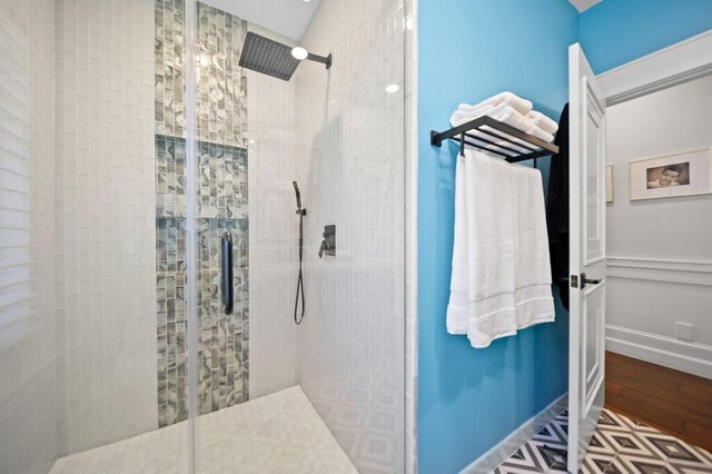 5211 SW Bimini Cir N, Palm City, FL 34990 - bathroom with a shower stall and wood finished floors