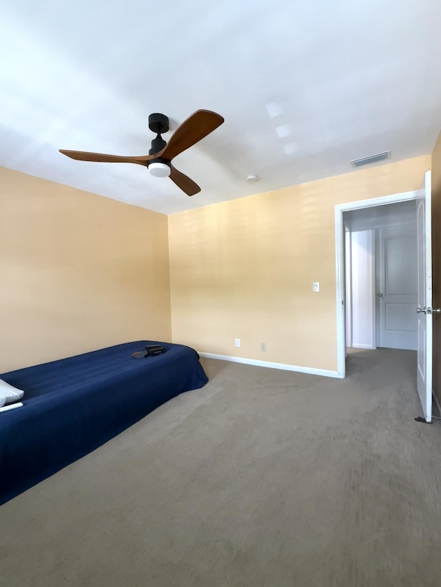 bedroom with carpet flooring, baseboards, and a ceiling fan