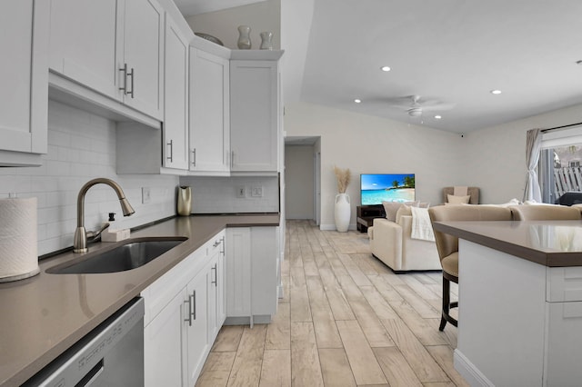 9794 Ridgecreek Rd, Boca Raton, FL 33496 - kitchen with dishwasher, a sink, decorative backsplash, recessed lighting, and a breakfast bar area