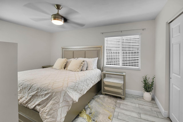 9794 Ridgecreek Rd, Boca Raton, FL 33496 - bedroom featuring ceiling fan, wood tiled floors, and baseboards