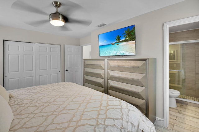 9794 Ridgecreek Rd, Boca Raton, FL 33496 - bedroom with wood finished floors, a closet, ensuite bathroom, and ceiling fan