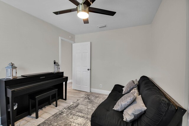 9794 Ridgecreek Rd, Boca Raton, FL 33496 - living area with a ceiling fan, baseboards, and light wood-style floors
